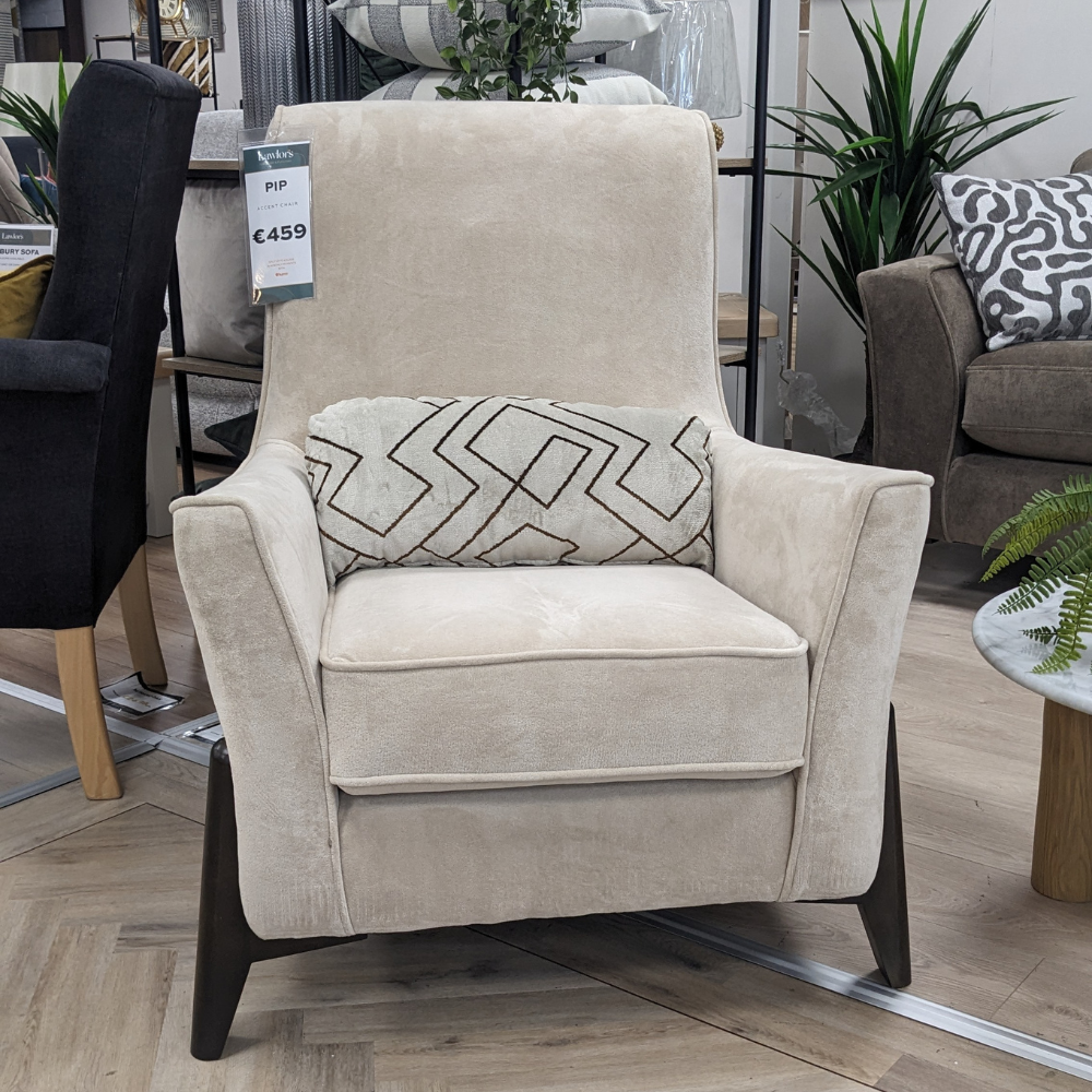 Discover the Pip Accent Chair in Cream, a stylish, comfortable and durable piece that adds modern elegance to any living space