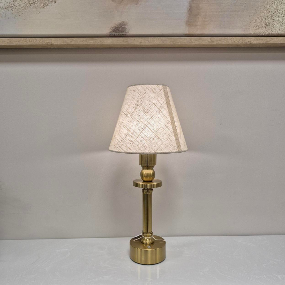 The Rechargeable LED Table Lamp 40cm offers RGBW colour, 3 light levels & tactile switch, an Antique Gold base & Linen Shade adding classic charm