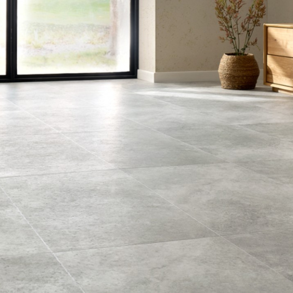 The Ribeira Silver Forma Tile SPC Flooring features sleek tile design, waterproof mineral core, Titanium Nano finish and 25 year warranty