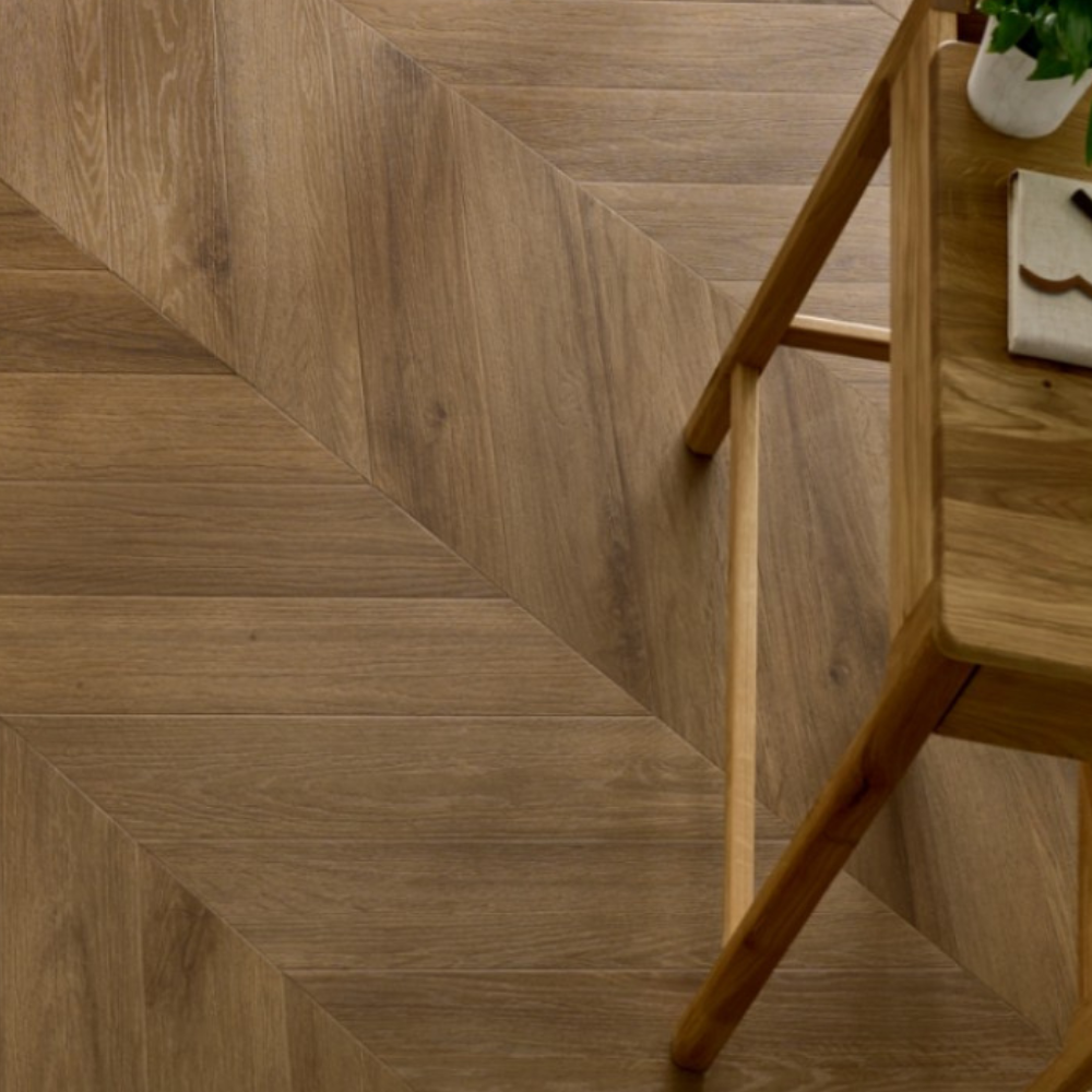 The Rochester Oak Chevron SPC Flooring features elegant chevron design, waterproof mineral core, 25 year warranty and Titanium Nano finish for durability
