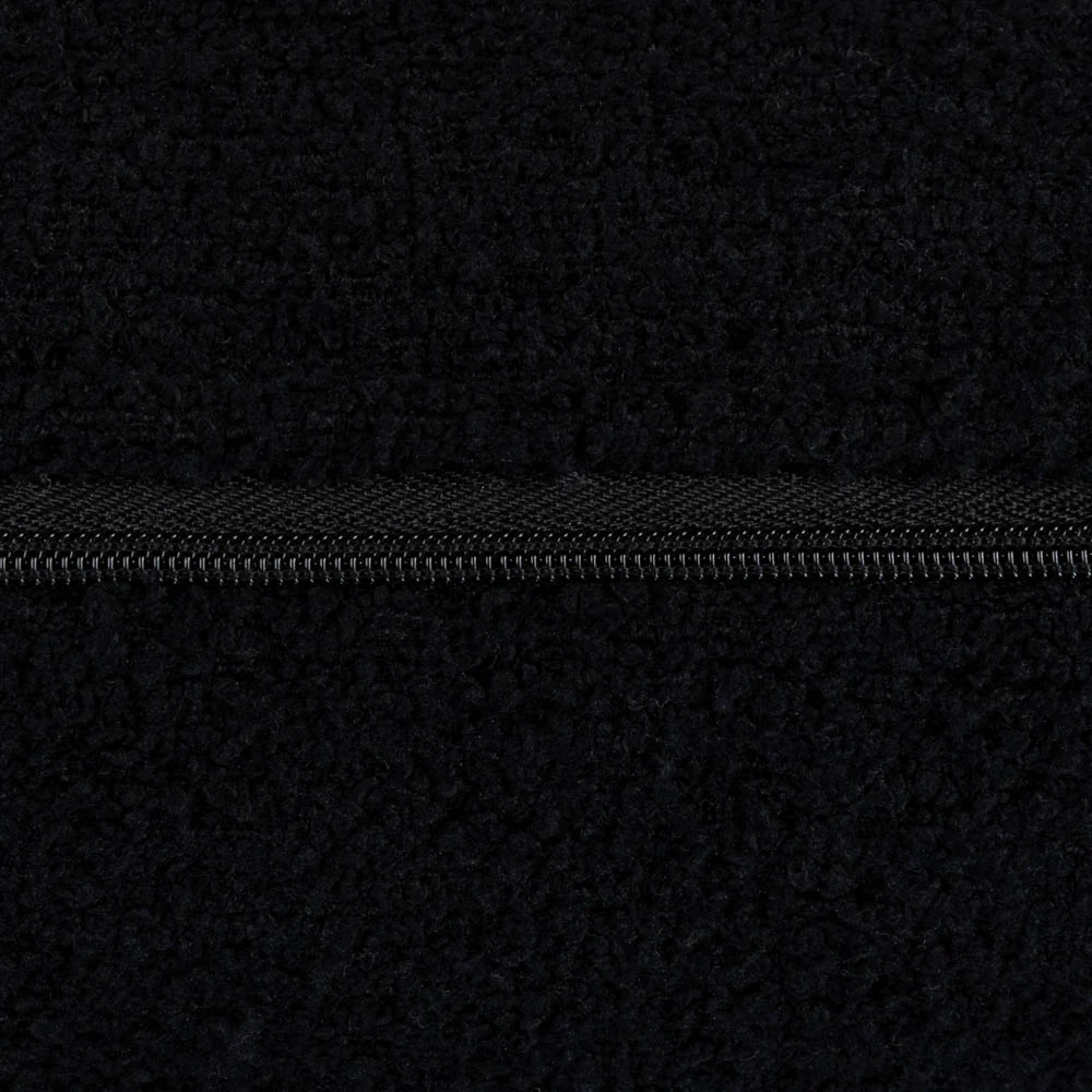 Handmade in Ireland, the Scatter Box Cora Cushion 35x50cm in black features a recycled boucle fabric, feather fill and elegant self piped edging