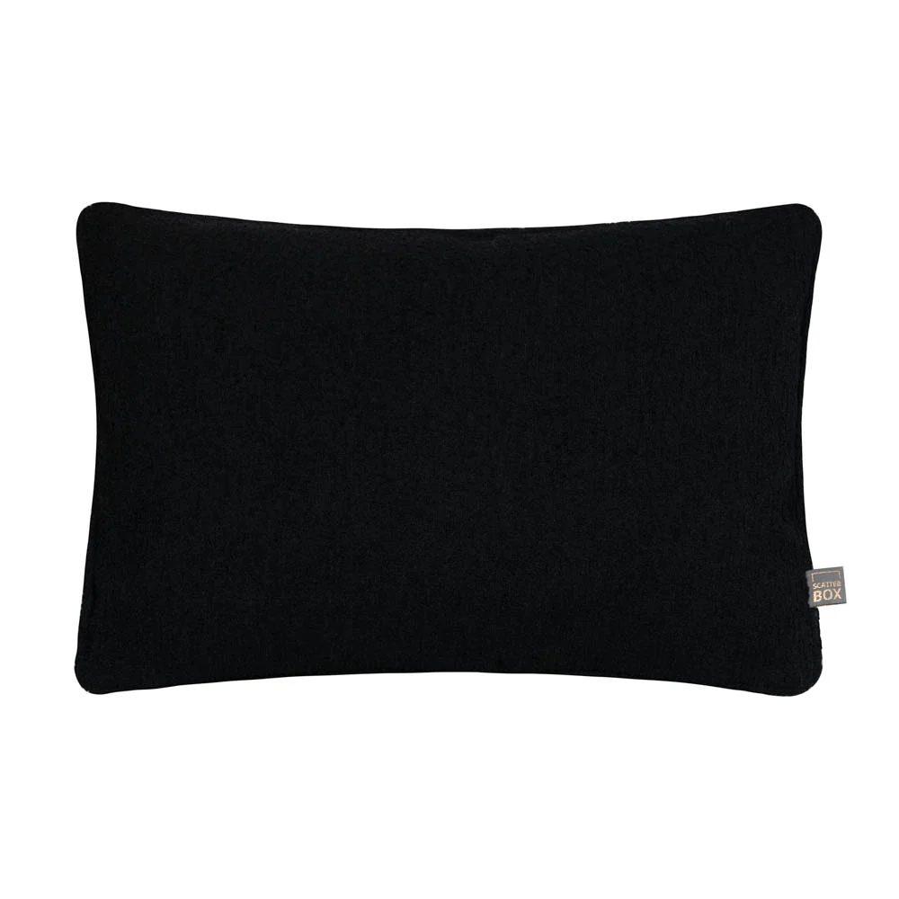 Handmade in Ireland, the Scatter Box Cora Cushion 35x50cm in black features a recycled boucle fabric, feather fill and elegant self piped edging