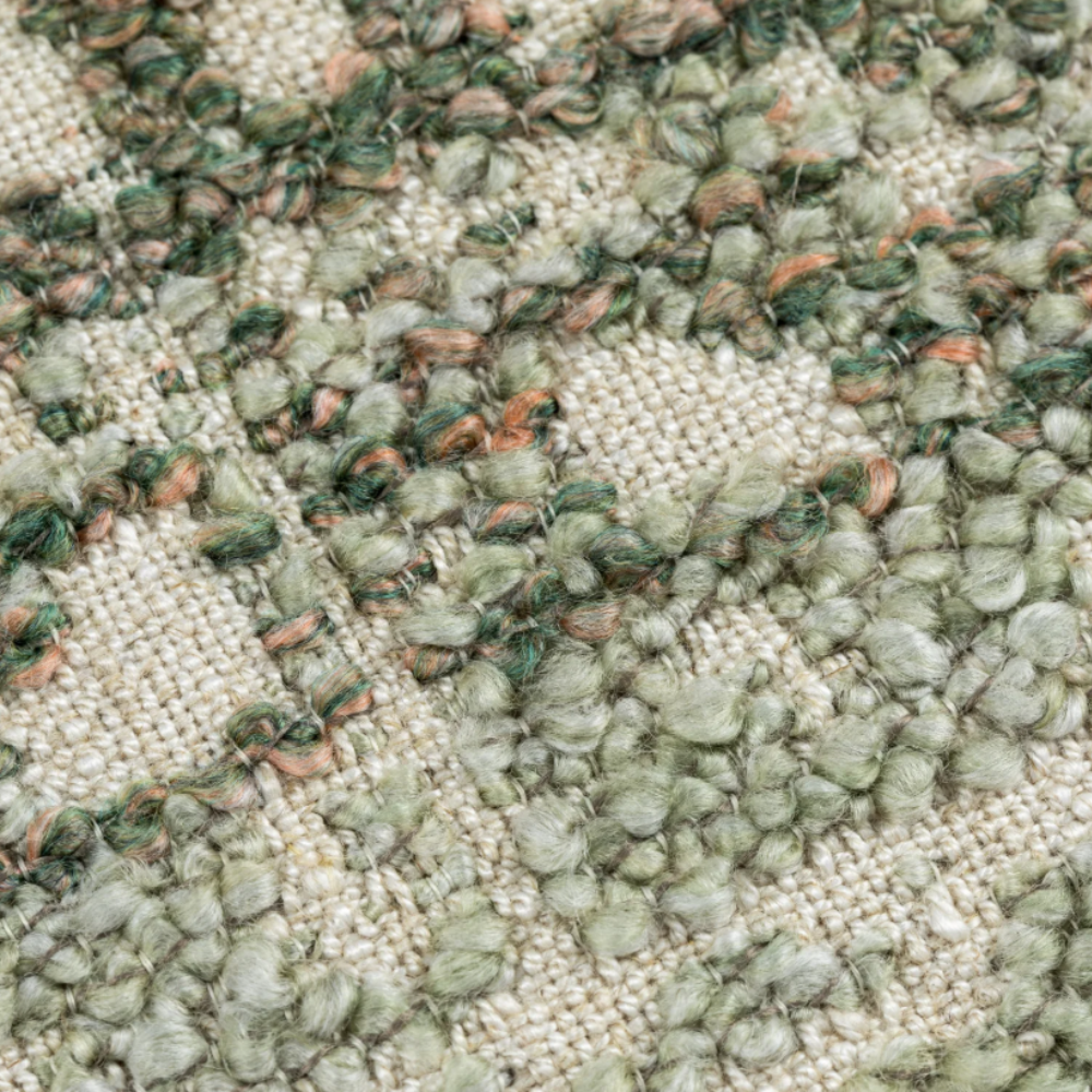 The Esme Scatter Box Green/Rose Cushion 43x43cm features a tactile fabric, subtle rose tones, a sleek knife-edge finish & handcrafted in Ireland.