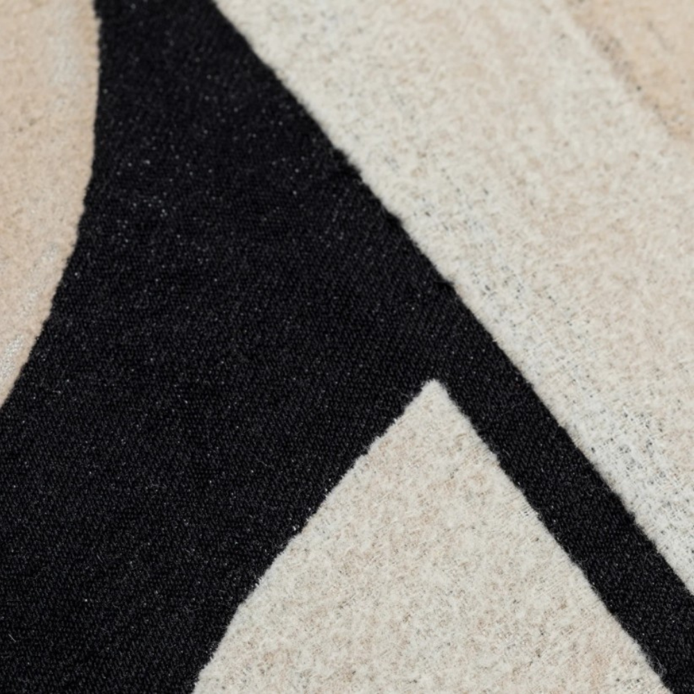 Add modern texture and elegance with the Scatter Box Vance Cushion 40x60cm in black and natural featuring a soft feather fill and boucle fabric