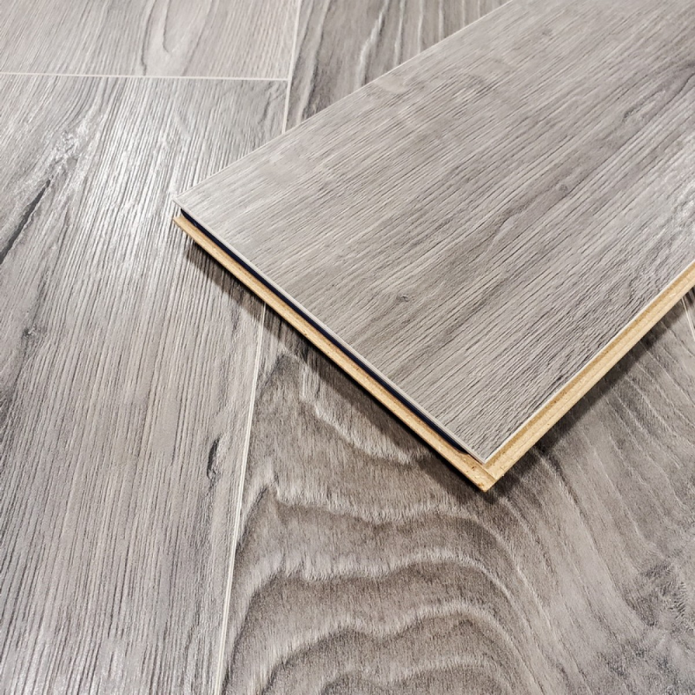 The Sound Fado Oak Laminate Flooring - 12mm features AC5 rated, 3D oak texture, easy click installation and a 30-year warranty.