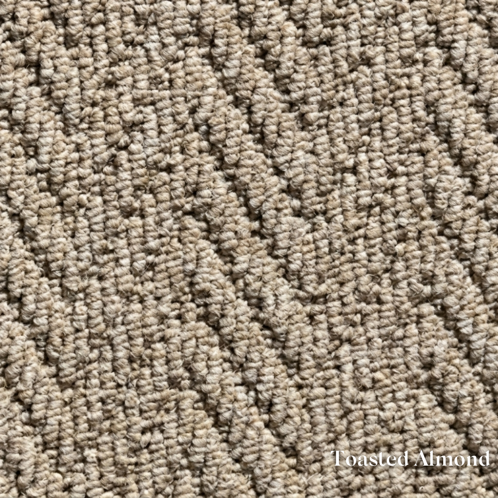 Close-up of textured beige carpet with 'Toasted Almond' label
