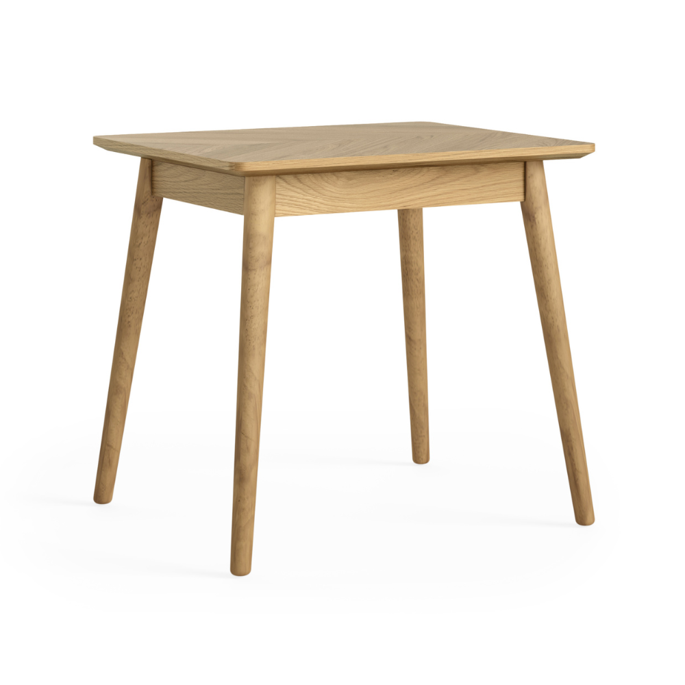 The Valencia Bistro Dining Table in solid oak with tapered legs that is compact, stylish and perfect for cozy dining spaces or breakfast nooks