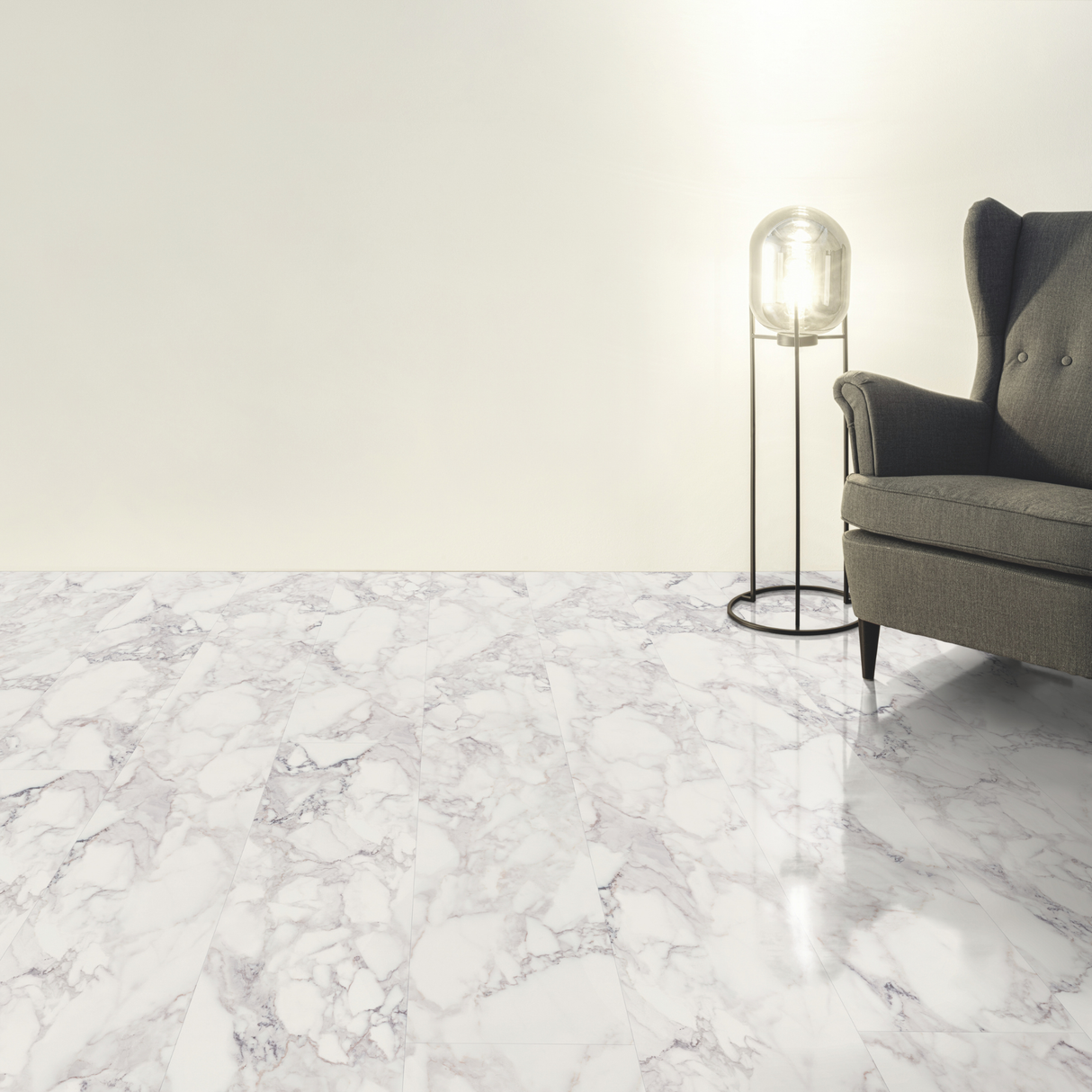 Living room with grey sofa and floor lamp on a marble effect laminate flooring