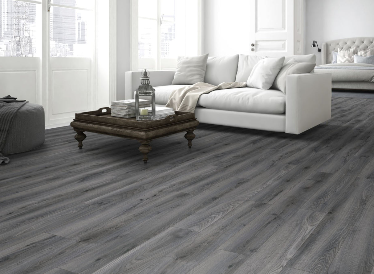 The Tomahawk Oak Laminate Flooring - 12mm features AC4 wear rating, antibacterial, realistic wood look, 20-year guarantee, underfloor heating compatible, Click2go locking system.
