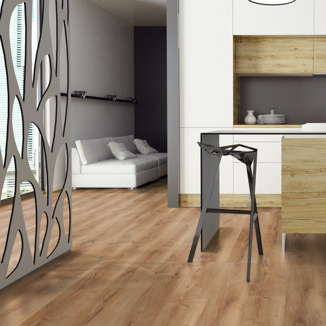 The Celtic Oak Laminate Flooring - 12mm features AC5-rated durability, warm brown tones and a 30-year warranty.