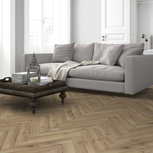 Enhance your space with Albany Oak Herringbone Laminate Flooring featuring an AC4 rating, underfloor heating compatible and easy-to-install choice.