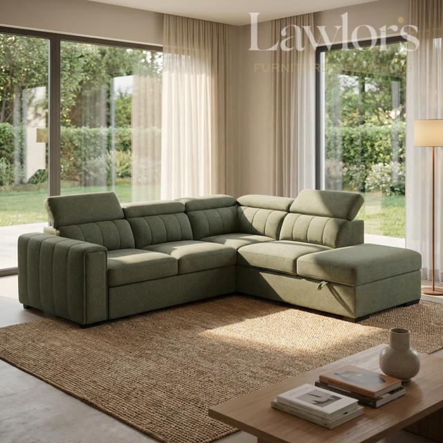 Green sectional RHF sofa bed in a living room with large windows