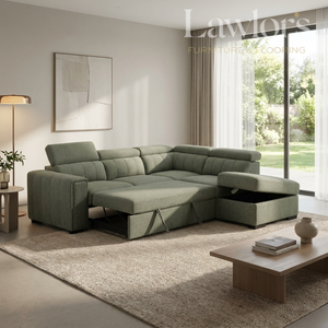 Modern living room with a green sectional opened RHF sofa bed, coffee table, and decorative elements.