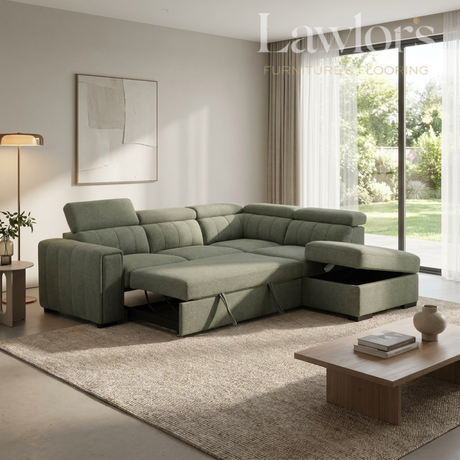 Modern living room with a green sectional opened RHF sofa bed, coffee table, and decorative elements.