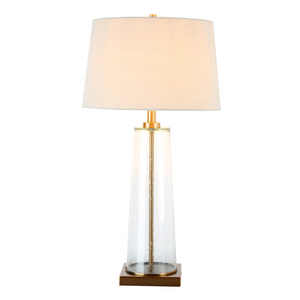 The elegant Amara Bubble Glass Table Lamp features a distinctive slanted base crafted from bubbled glass