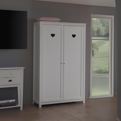 The Amori White 2 Door Wardrobe with hearts offers romantic style and space for storing various clothing, bed linen and ample storage for accessories