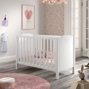 The Amori Baby Bed 60 x 120cm in White offers a romantic hearts detail, 3 height slatted base & a Belgian design, perfect for a stylish baby room with charm