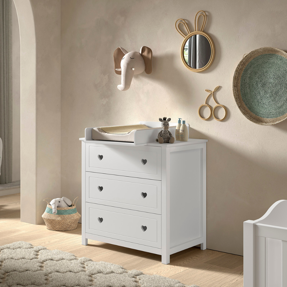 The Amori Dresser with Changing Top White baby room dresser with hearts & romantic charm includes attachment for changing or diaper mat & soft close drawers