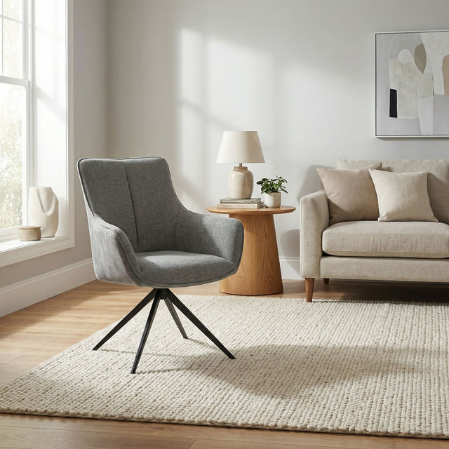 Grey fabric swivel chair in sitting room setting