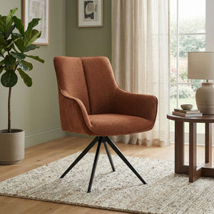 Orange fabric swivel chair in sitting room setting