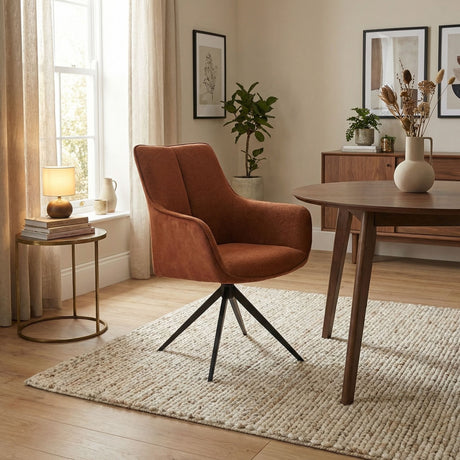 Orange fabric swivel chair in sitting room setting in dining table