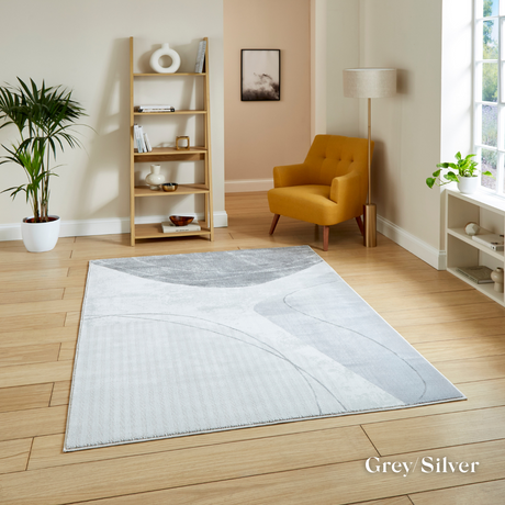 Introduce fresh style with the Apollo Modern Abstract Machine Made Rugs featuring a blend of bold designs, metallic yarn and soft multi textured pile.