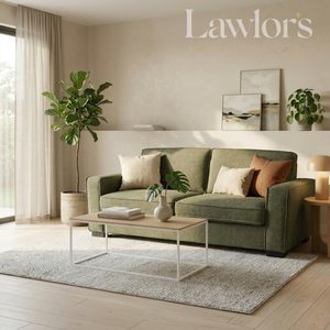 An olive green fabric sofa in a beautifully styled living room, decorated with neutral and earthy throw pillows, a wooden coffee table, a textured rug, and potted plants.