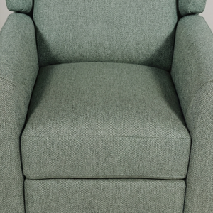 Sage upholstered armchair with textured fabric
