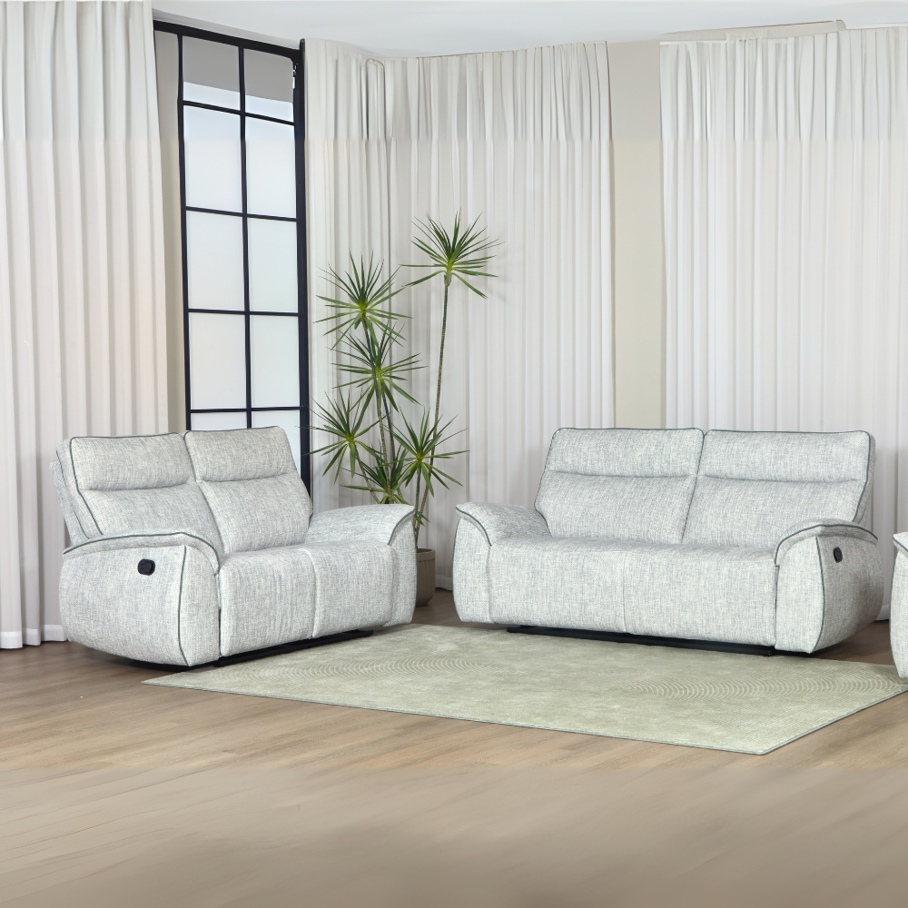 The Aston Recliner Sofa in Light Grey features plush comfort, smooth recliners and modern style, perfect for relaxing in any living space