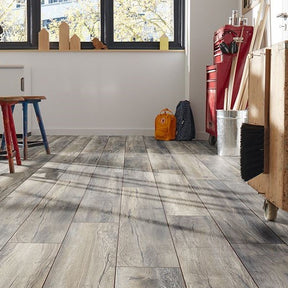 Barn Oak Laminate 8mm: Rustic wide plank, AC4 rated for durability, 5G click system for easy installation, 25-year residential warranty, and underfloor heating compatible