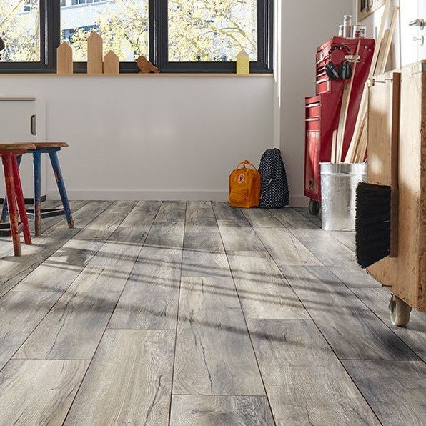Barn Oak Laminate 8mm: Rustic wide plank, AC4 rated for durability, 5G click system for easy installation, 25-year residential warranty, and underfloor heating compatible