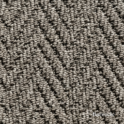 Close-up of textured gray carpet with 'Barnacle' branding.