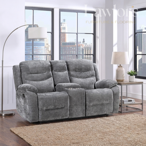 A gray plush 2 seater console reclining sofa shown in a modern living room setting with a floor lamp, side table, lamp, and city view windows.
