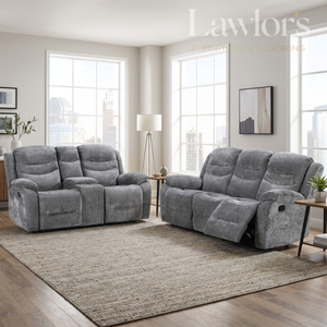 A grey 2 seater and a matching grey 3 seater recliner sofa set with centre armrests, shown in a bright modern living room with large windows, a beige rug, and wood flooring.