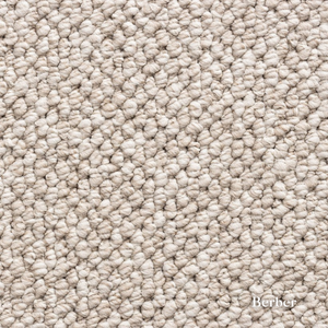 Close-up of beige carpet texture with 'Berber' brand name.