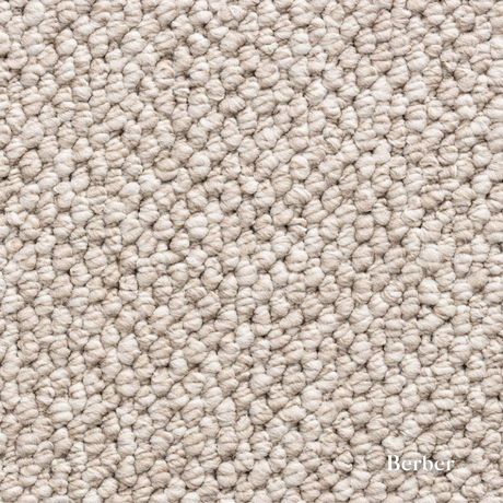 Close-up of beige carpet texture with 'Berber' brand name.