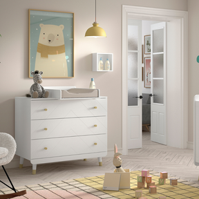 The Billy 3 Dresser with Changing Unit in White comes with a changing board attachment, golden accents and 3 drawers, perfect for a stylish baby room