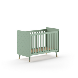 The Billy Baby Cot Bed in Olive Green features a geometric graphic design, golden accents and an adjustable slatted base, perfect for a modern nursery setup