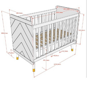 The Billy Baby Cot Bed in Olive Green features a geometric graphic design, golden accents and an adjustable slatted base, perfect for a modern nursery setup