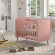The Billy Baby Cot Bed in Terra Pink features a geometric graphic design, golden accents and an adjustable slatted base, perfect for a modern nursery setup