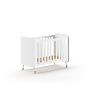 The Billy Baby Cot Bed in Satin White features a geometric graphic design, golden accents and an adjustable slatted base, perfect for a modern nursery setup