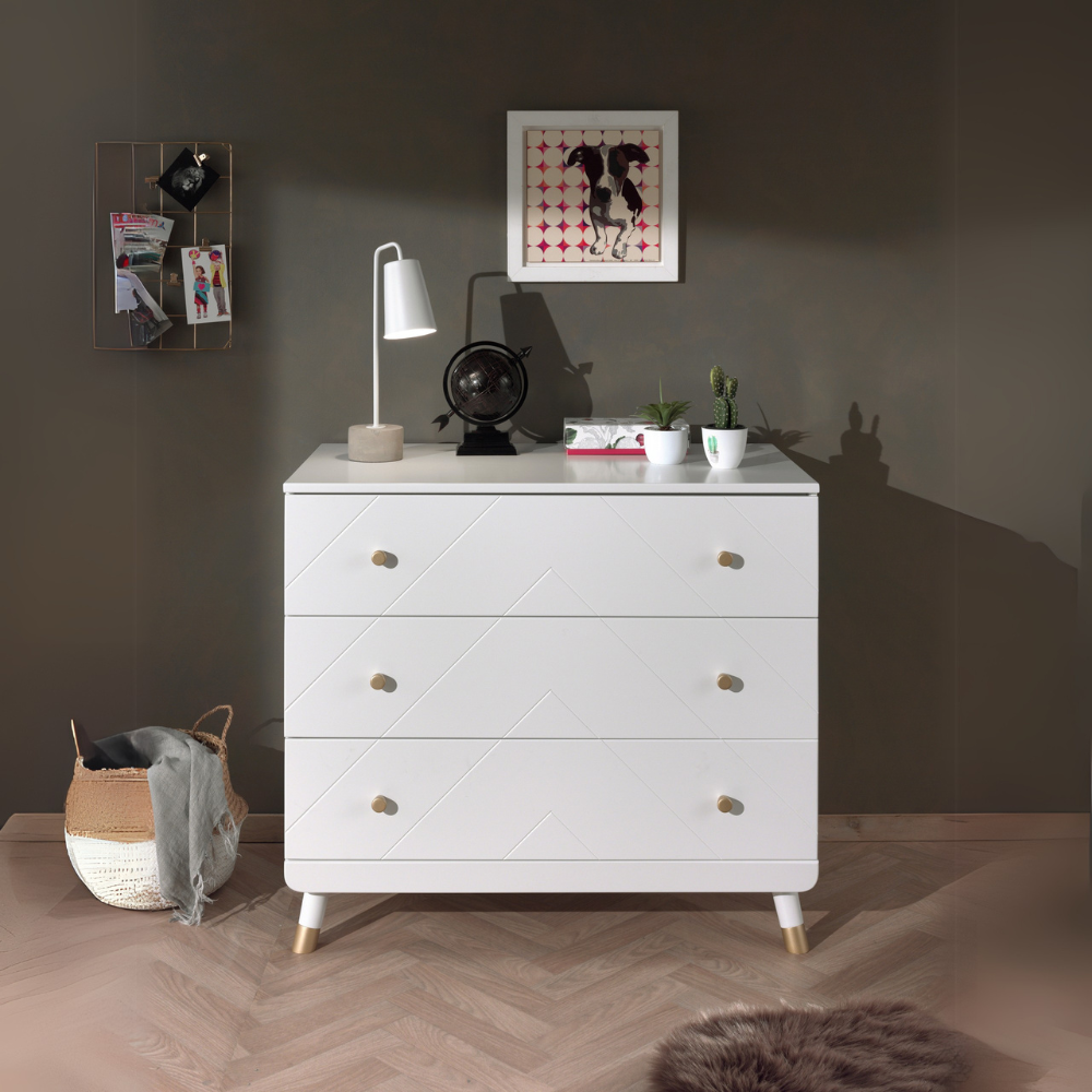 The Billy Chest of 3 Drawers in Satin White features golden accents & 3 spacious drawers, a changing care table with ample storage space for baby essentials