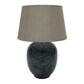 The Blue Waves Lamp is stunning showcase of traditional craftsmanship, crafted from ceramic and taupe linen shade