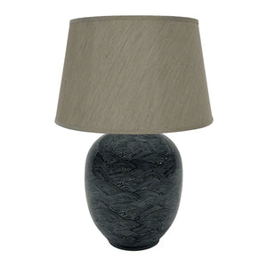 The Blue Waves Lamp is stunning showcase of traditional craftsmanship, crafted from ceramic and taupe linen shade