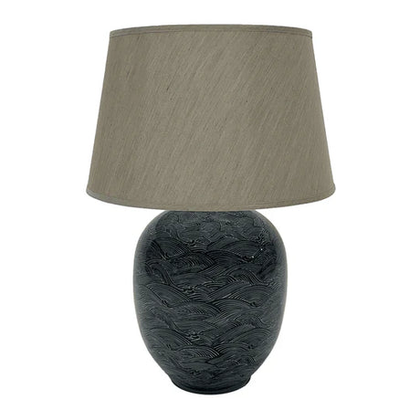 The Blue Waves Lamp is stunning showcase of traditional craftsmanship, crafted from ceramic and taupe linen shade