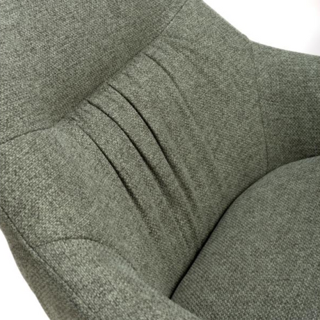 The Boden Bar Chair in Sage Green offers luxurious fabric comfort, chic pleated details, robust black metal legs