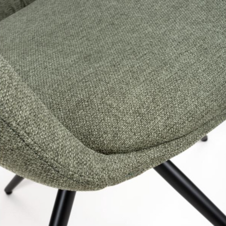 The Boden Carver Chair in Sage Green blends modern style with comfort, plush fabric upholstery, sleek metal legs