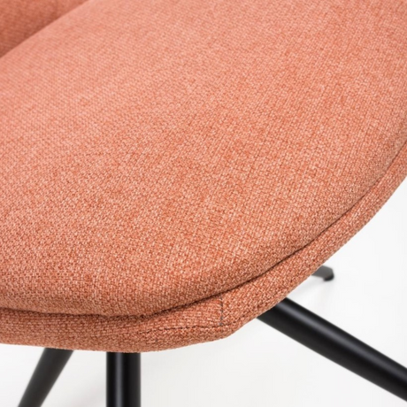 The Boden Chair in Sage Green, Natural or Brick features soft fabric upholstery, pleated accents, robust black metal legs