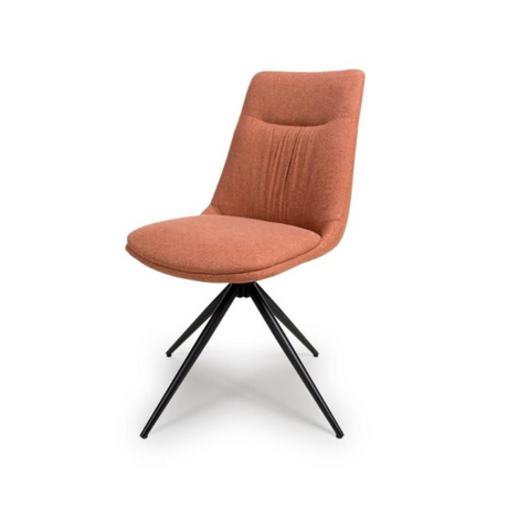 The Boden Chair in Sage Green, Natural or Brick features soft fabric upholstery, pleated accents, robust black metal legs