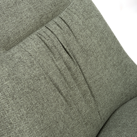 The Boden Chair in Sage Green features soft fabric upholstery, pleated accents, robust black metal legs along